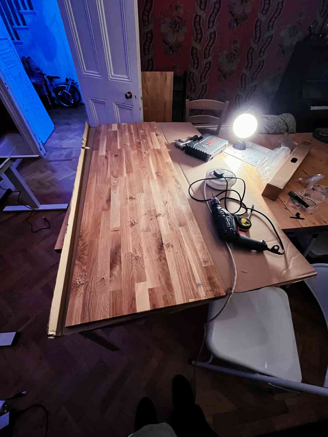 Drilling holes at night with a work lamp